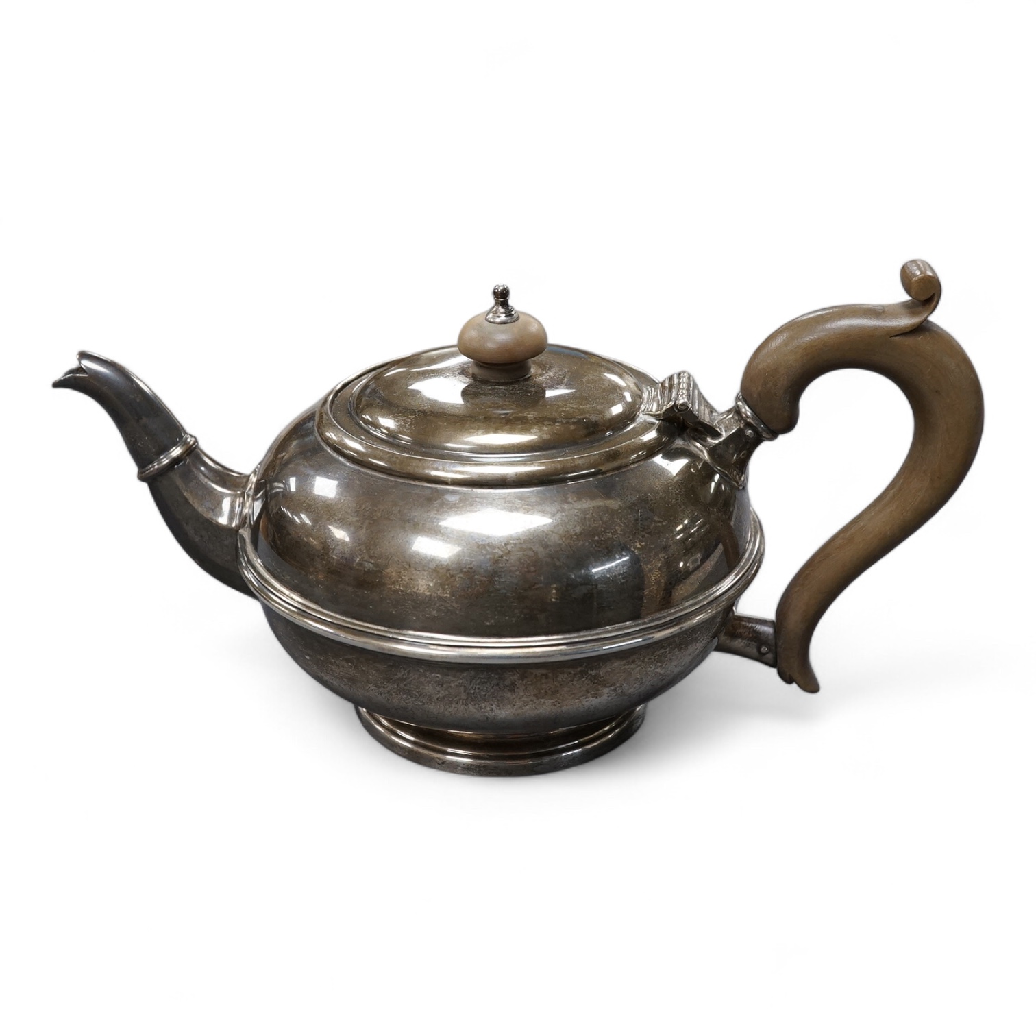 A George V silver circular teapot, by Goldsmiths & Silversmiths Co Ltd, London, 1918, gross 17.5oz.